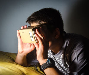 Boy wearing virtual reality at home