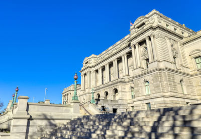 Low angle view of historical building against blue sky