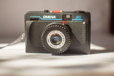 Close-up of camera on table