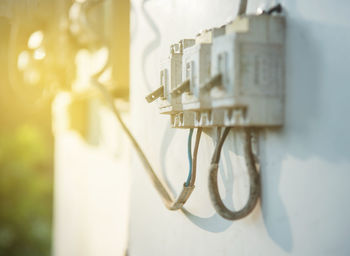 Close-up of electric equipment on wall