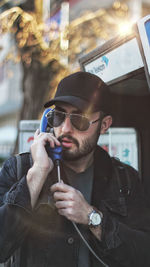 Portrait of young man smoking cigarette