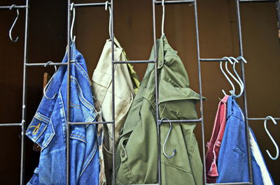 Close-up of clothes hanging on rack