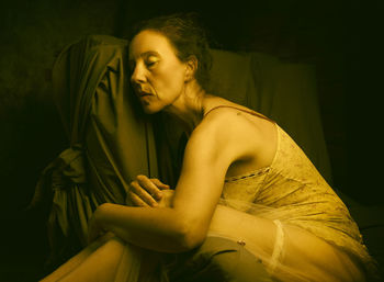 Woman lying in a chair