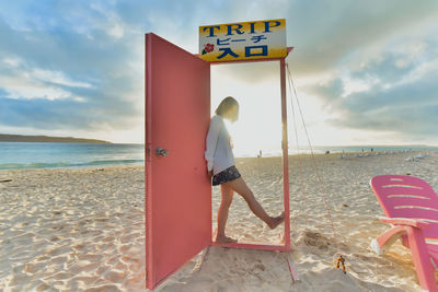 Man on beach against sky