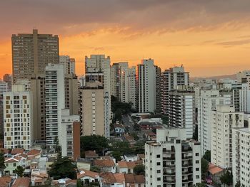 High angle view of buildings against sky during sunset