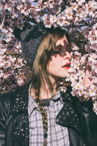 Close-up of woman with pink flowers