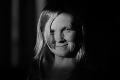 Close-up portrait of smiling young woman