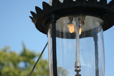 Low angle view of street light against sky