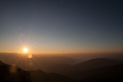 Scenic view of mountains against sky during sunset