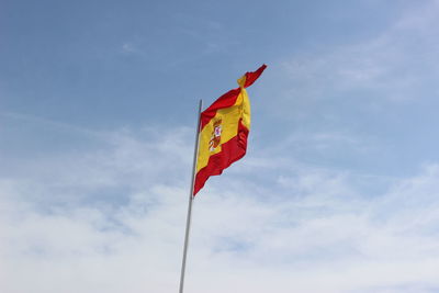 Low angle view of flag against sky