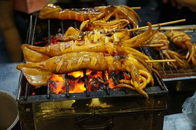 High angle view of squids on barbecue grill