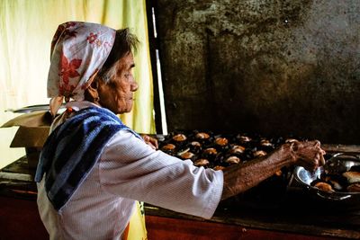 Side view of woman working