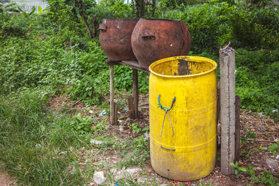 Old rusty metal on field