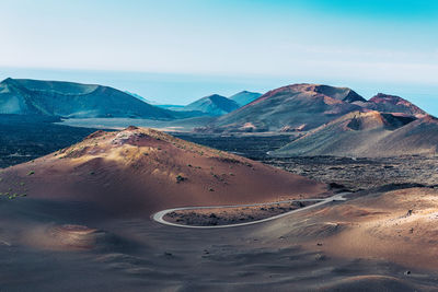Scenic view of timanfaya national park mountains against sky