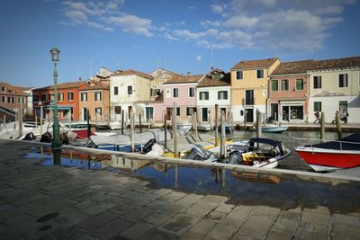 Boats moored at harbor