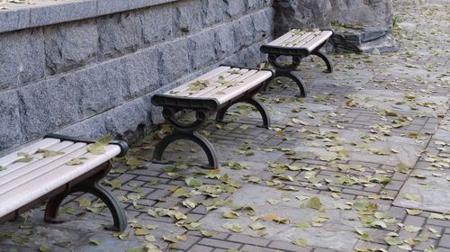 High angle view of seat on cobblestone