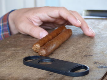 Close-up of man preparing food on table