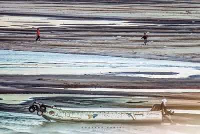 People walking on beach