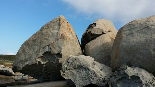 Low angle view of rocks against sky