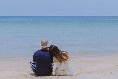 Rear view of women on beach