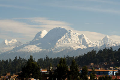 Scenic view of snow covered mountains against sky
