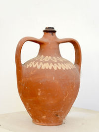 Close-up of jug against white background