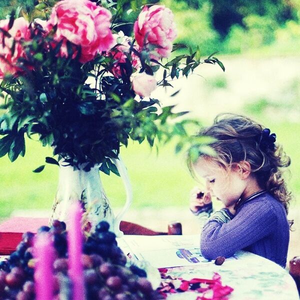 person, flower, lifestyles, childhood, leisure activity, girls, elementary age, focus on foreground, headshot, park - man made space, pink color, boys, casual clothing, fragility, innocence, smiling, happiness, day