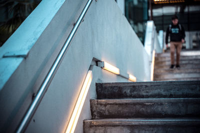 Man walking on staircase