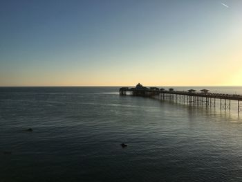 Scenic view of sea against clear sky during sunset