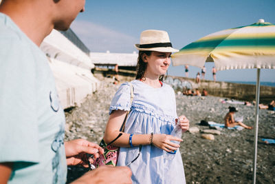 Young couple standing on beach