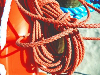 Red rope tied on life belt during sunny day
