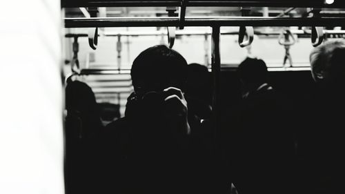 Man with arms raised in background