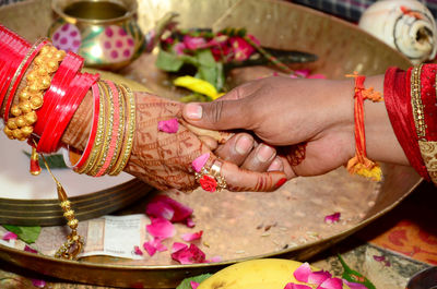 Low section of woman with tattoo on hands