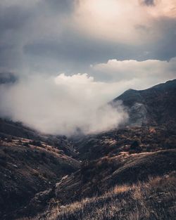 Aerial view of mountain range against sky