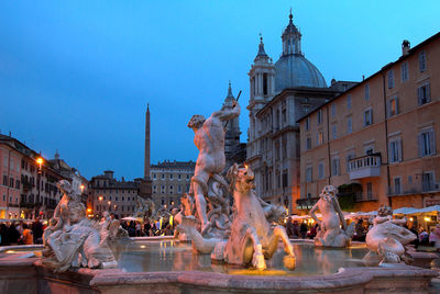 Fountain lit up at night