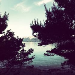 Scenic view of sea against cloudy sky