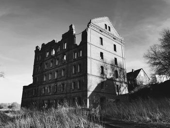 Low angle view of old building against sky