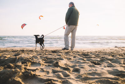 Man with dog at the beach