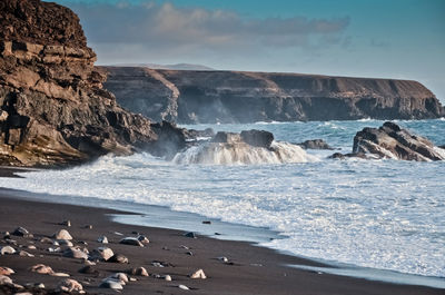 Scenic view of beach against sky