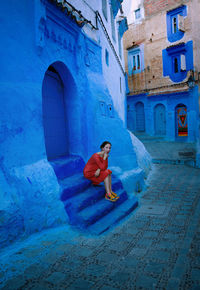 Woman with orange dress in chefchaouen