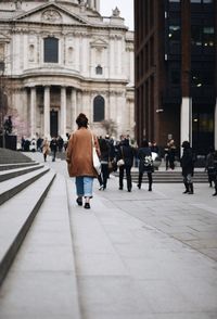 People walking in front of building