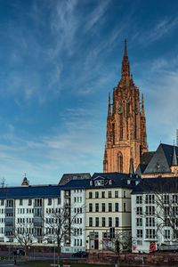 Buildings in city against sky