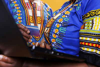 Midsection of woman using laptop