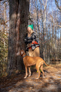 Portrait of woman standing in forest