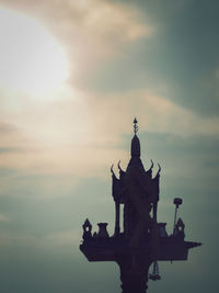 Temple against sky during sunset