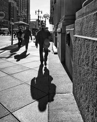 People walking on street in city