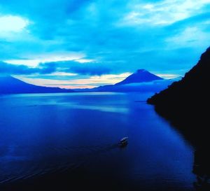 Scenic view of sea against blue sky