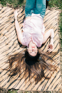 High angle view of woman lying down