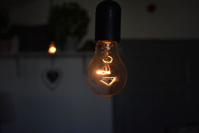 Close-up of illuminated light bulb