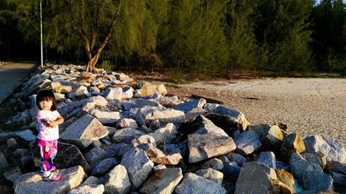 Woman standing on rock